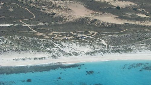 A man was bitten by a shark at 14 Mile Beach, near Coral Bay in WA while spear fishing.