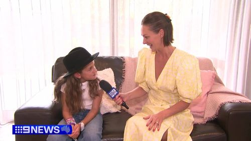 Milana told 9News she was given a guitar pick and a signed felt hat from Taylor Swift.