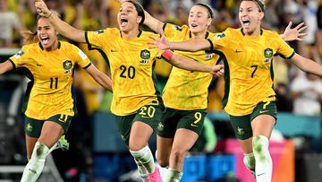 Australia celebrate their victory in the penalty shoot out against France.