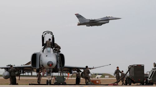 A F16 fighter (top) of the US Air Force takes off during the Seventh Air Force and the 8th Fighter Wing Max Thunder exercise at the eighth Fighter Wing in Gunsan, South Korea, 20 April 2017. Picture: EPA/AAP