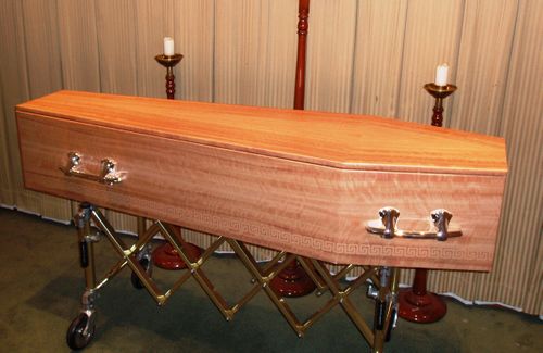 The 74-year-old grandmother was moved from her oak, silk-lined coffin to a pine box similar to this (AAP).