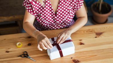 Woman wrapping Christmas presents