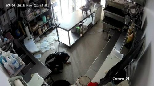 The thief fell to the ground during his robbery of the pizza store. Picture: Supplied