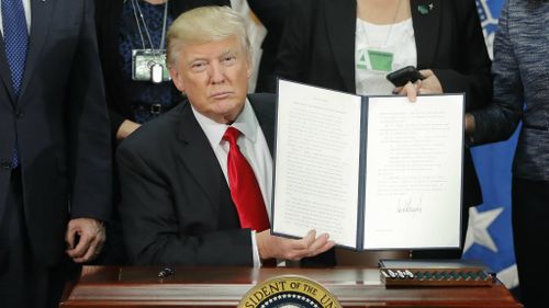 Mr Trump has signed an executive order to begin construction on the border wall. (AAP)