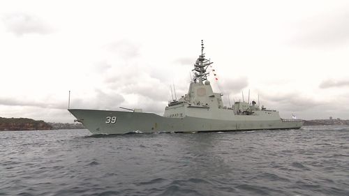 HMAS Hobart comes through the heads at Sydney Harbour this morning.