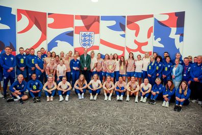 Prince William, Prince of Wales and President of The Football Association, poses with the England team during a visit to England Women's team to wish them luck ahead of the 2023 FIFA Women's World Cup at St Georges Park on June 20, 2023 in Burton-upon-Trent, England