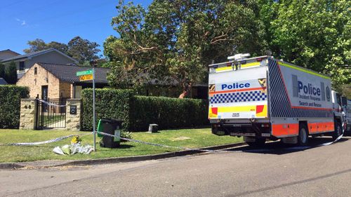 Flowers left by neighbours outside a home in Davidson, Sydney on Tuesday, Oct 18, 2016. Fernando Manrique, Maria Claudia Lutz, and their special needs children Martin and Elisa, were found dead in the home.