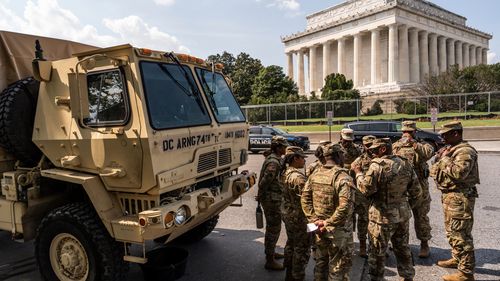 Members of the District of Columbia National Guard gather next to the Lincoln Memorial, Sunday, Aug. 17, 2025, in Washington.