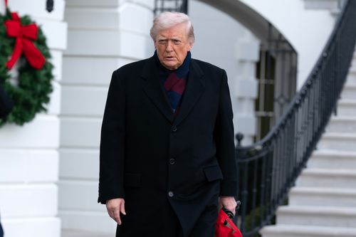 President Donald Trump talks to reporters as he departs from the South Lawn of the White House, Saturday, Dec. 13, 2025, in Washington, en route to Baltimore to attend the Army-Navy football game. (AP Photo/Jose Luis Magana)