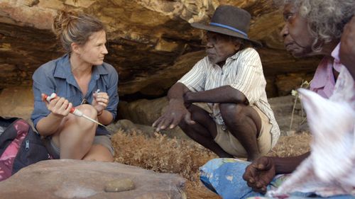 Elspeth Hayes with Mark Djandjomerr and traditional owner May Nango extracting samples at a cave adjacent to the Madjedbebe rock shelter in the Kakadu National Park in the Northern Territory (AAP Image/Gundjeihmi Aboriginal Corporation, Vincent Lamberti).