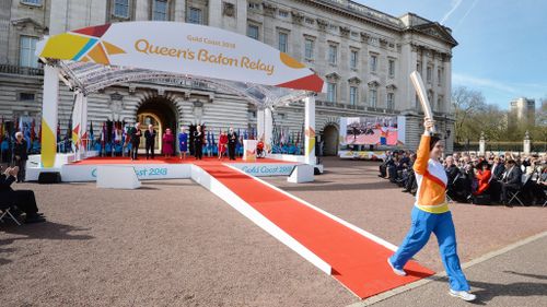 Anna Meares begins the baton relay outside Buckingham Palace. (AAP)