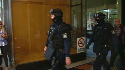 Riot police have surrounded Downing Centre Local Court in Sydney's CBD. (9NEWS)