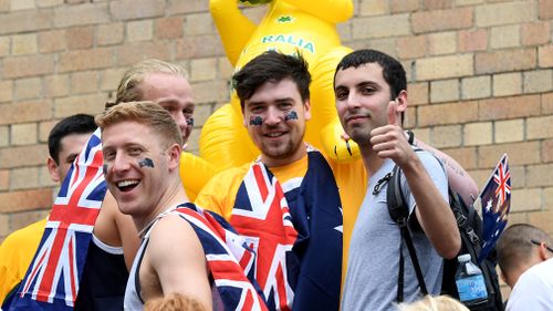 People watch The Ferrython race on Sydney Harbour during Australia Day celebrations in 2017. (AAP)