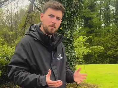 Thomas from McCoubrey K9 Services explains dog obedience while outside.