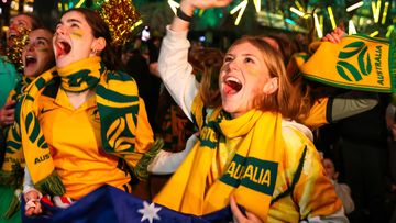 Australian fans celebrate as the Matildas beat Denmark