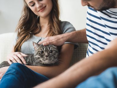 Young couple with cat