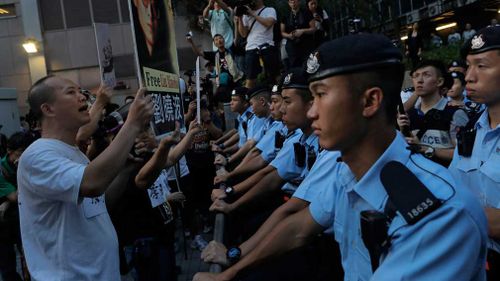 China's Xi warns protesters not to cross 'red line' in Hong Kong