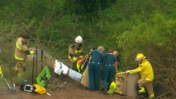Rescue crews in Queensland had their work cut out for them as they attempted to free a man trapped under a steam roller.