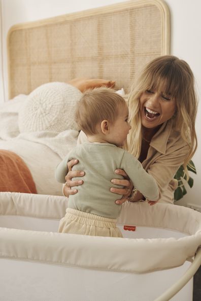 Elyse Knowles with her baby Sunny in the Fisher Price Bassinet. 