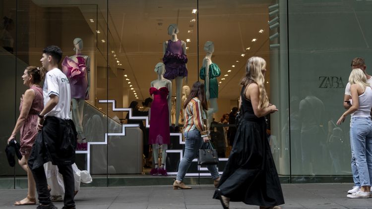 A young man working at a fast food counter