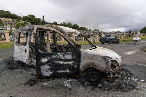 The gutted remains of a car after unrest in Noumea, New Caledonia, Wednesday May 15, 2024. France has imposed a state of emergency in the French Pacific territory of New Caledonia. The measures imposed on Wednesday for at least 12 days boost security forces' powers to quell deadly unrest that has left four people dead, erupting after protests over voting reforms. (AP Photo/Nicolas Job)