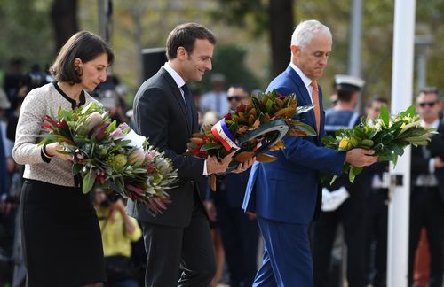 President Emmanuel Macron pays his respects to fallen French and Australian soldiers at Sydney's Anzac Memorial. Picture: AAP