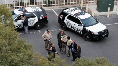 Las Vegas police investigate the vandalism of the billboard.(AP).