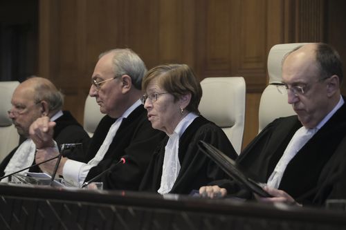 Presiding judge Joan Donoghue, centre, speaks during session at the International Court of Justice, or World Court, in The Hague, Netherlands, Friday, Jan. 26, 2024. 