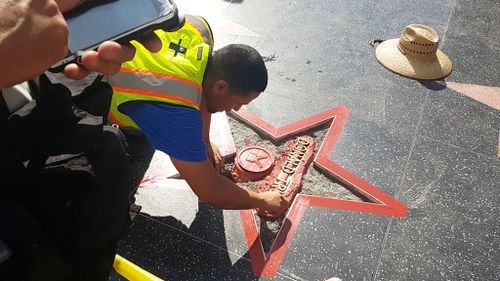 A repair crew is already replacing the defaced star. (9NEWS/Ehsan Knopf)