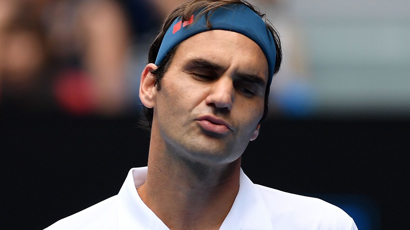 Agitated Roger Federer scrapes through against controversial Brit Dan Evans