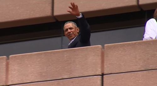 Barack Obama waves at crowds during a trip to the Sydney Opera House (9NEWS)