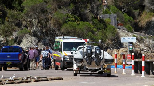 Man dead, four fishermen rescued after being swept off rocks on NSW South Coast