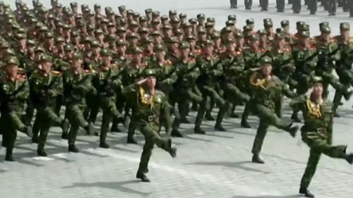 Rows of military bands marched into the vast square. (AFP)