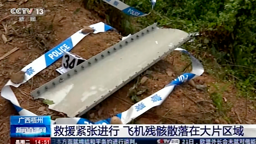 Wreckage of a China Eastern plane that one day earlier inexplicably fell from the skies is scattered over the remote mountainside.