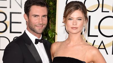 Adam Levine and Behati Prinsloo attend the 72nd Annual Golden Globe Awards at The Beverly Hilton Hotel on January 11, 2015 in Beverly Hills, California.