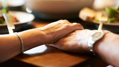 Couple holding hands