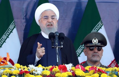 Iran's president has accused an unnamed US-allied country in the Persian Gulf of being behind a terror attack on a military parade that killed 25 people and wounded 60. (AAP)