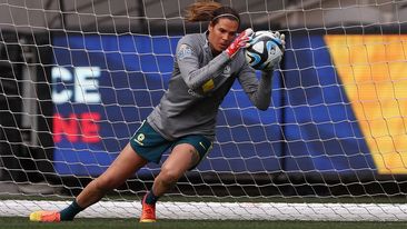 Matildas goalkeeper Lydia Williams dives for the ball during a training session.