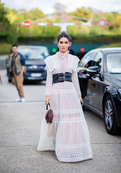 Camila Coelho, wearing a Dior white dress, is seen before the Christian Dior show, on September 24, 2018 in Paris, France.&nbsp;