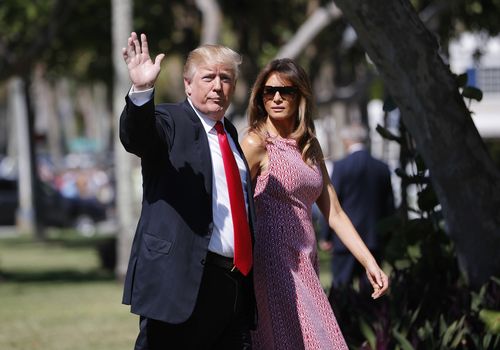 Mr Trump gives photographers a wave. (AAP)