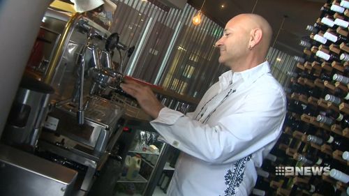 Main Beach restaurant owner Carlo Percuoco said he would join a class action to recoup their losses. (9NEWS)