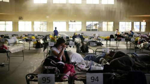 Thousands of people are sheltering in evacuation centres. (AFP)