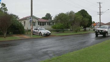 Mystery surrounds the death of a Toowoomba woman who was found dead in her front yard.