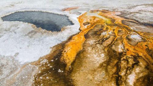 The geyser at Yellowstone National Park which has spewed garbage.