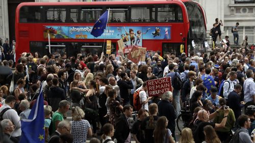 Anti-Brexit supporters gather outside 10 Downing Street after Johnson's move to suspend parliament.