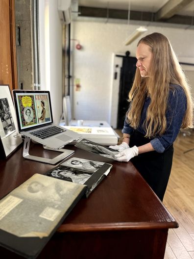 Camera Press owner and co-director Emma Blau showing Queen Elizabeth II coronation images used on magazine covers
