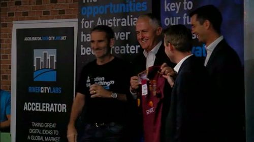 Prime Minister Malcolm Turnbull presented with a Maroons jumper (9NEWS)
