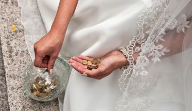 Bride holding coins