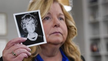 assau County District Attorney Anne Donnelly holds a photo of Diane Cusick during an interview with The Associated Press, Wednesday, June 22, 2022, in Mineola, N.Y. More than 50 years after a woman was found dead in her car at a mall on Long Island, authorities prosecutors are expected to announce that DNA evidence has linked the slaying to Richard Cottingham, a serial killer who has been connected to 11 murders in New York and New Jersey between 1965 and 1980. (AP Photo/Mary Altaffer)
