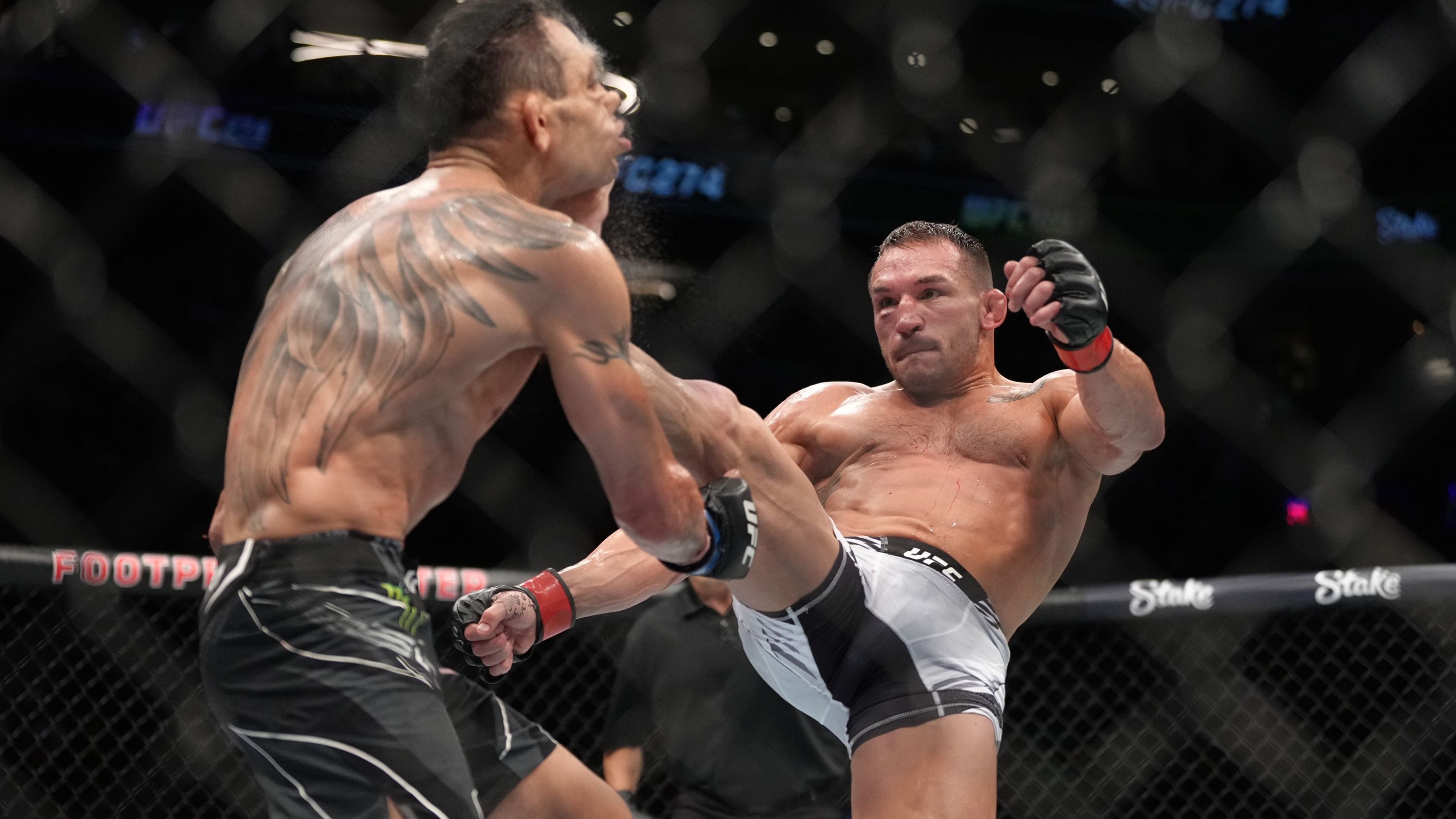 Michael Chandler KO&#x27;s Tony Ferguson in their lightweight fight during UFC 274.